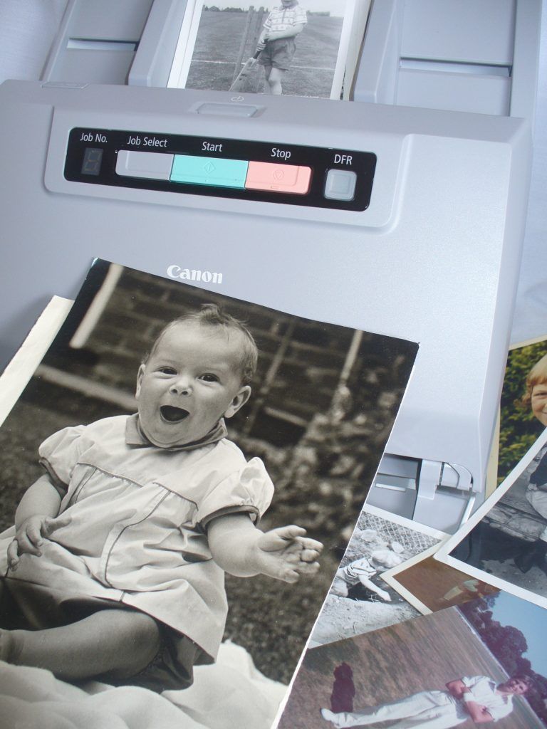 Photo scanner digitising a baby photo for Scan Photos Perth